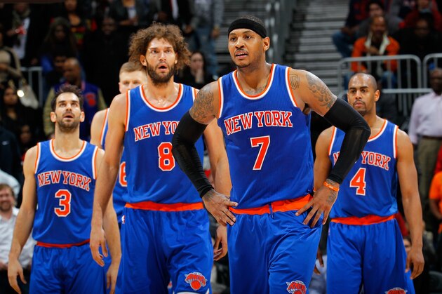 ATLANTA, GA - JANUARY 05:  Carmelo Anthony #7 of the New York Knicks reacts in the final seconds of their 107-101 win over the Atlanta Hawks at Philips Arena on January 5, 2016 in Atlanta, Georgia.  NOTE TO USER User expressly acknowledges and agrees that, by downloading and or using this photograph, user is consenting to the terms and conditions of the Getty Images License Agreement.  (Photo by Kevin C. Cox/Getty Images)