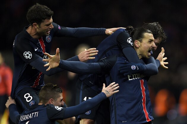 Paris Saint-Germain's Swedish forward Zlatan Ibrahimovic (R) celebrates with teammates after scoring a goal  during the Champions League round of 16 first leg football match between Paris Saint-Germain (PSG) and Chelsea FC on February 16, 2016, at the Parc des Princes stadium in Paris. PSG won 2-1.   / AFP / FRANCK FIFE        (Photo credit should read FRANCK FIFE/AFP/Getty Images)