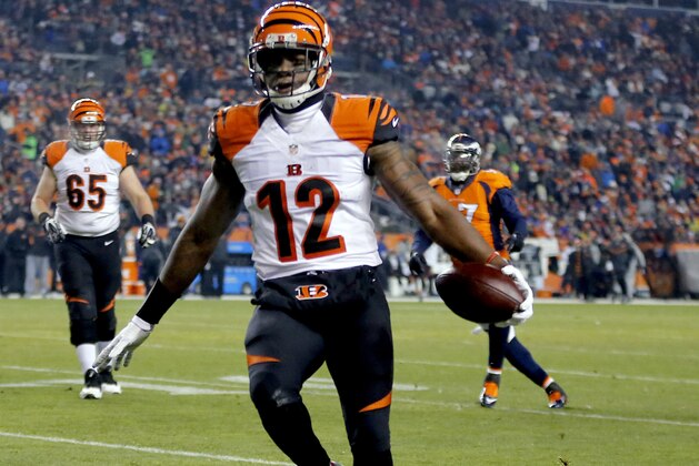 Cincinnati Bengals wide receiver Mohamed Sanu (12) scores a touchdown against the Denver Broncos during the first half of an NFL football game, Monday, Dec. 28, 2015, in Denver. (AP Photo/Jack Dempsey)