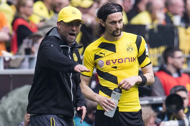 coach Jurgen Klopp of Borussia Dortmund give instructions to Neven Subotic of Borussia Dortmund during the Bundesliga match between Borussia Dortmund and Werder Bremen on May 23, 2015 at the Signal Iduna Park in Dortmund, Germany.(Photo by VI Images via Getty Images)