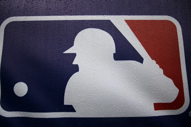 Rain drops cover the Major League Baseball logo before the start of Game 3 of the American League baseball championship series between the Baltimore Orioles and the Kansas City Royals Monday, Oct. 13, 2014, in Kansas City, Mo. The Royals lead the series 2-0. (AP Photo/Matt Slocum )