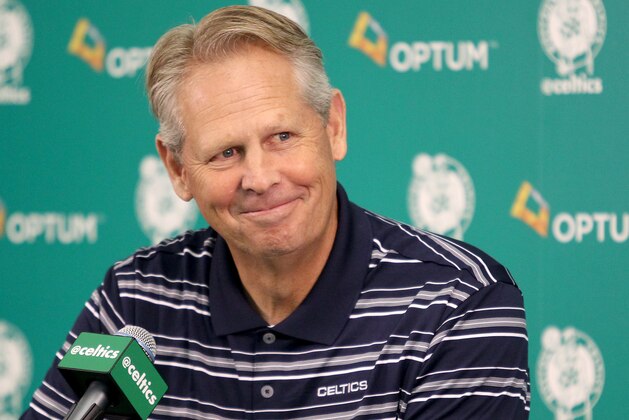 Danny Ainge, president of basketball operations, smiles as he listens to a question during the team's NBA basketball media day at their training facility in Waltham, Mass., Friday, Sept. 25, 2015. (AP Photo/Mary Schwalm)