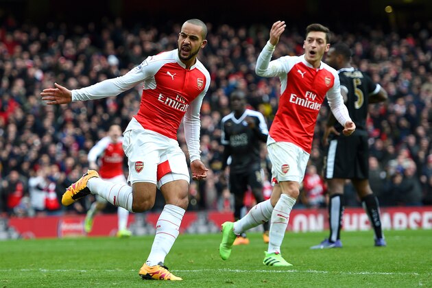 LONDON, ENGLAND - FEBRUARY 14:  Theo Walcott of Arsenal celebrates after scoring his team's first goal during the Barclays Premier League match between Arsenal and Leicester City at Emirates Stadium on February 14, 2016 in London, England.  (Photo by Ross Kinnaird/Getty Images)