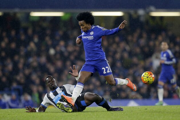Chelsea's Willian, right, competes for the ball with Newcastle United's Cheick Tiote during the English Premier League soccer match between Chelsea and Newcastle United at Stamford Bridge stadium in London, Saturday, Feb. 13, 2016.  (AP Photo/Matt Dunham)