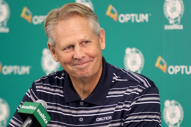 Danny Ainge, president of basketball operations, smiles as he listens to a question during the team's NBA basketball media day at their training facility in Waltham, Mass., Friday, Sept. 25, 2015. (AP Photo/Mary Schwalm)