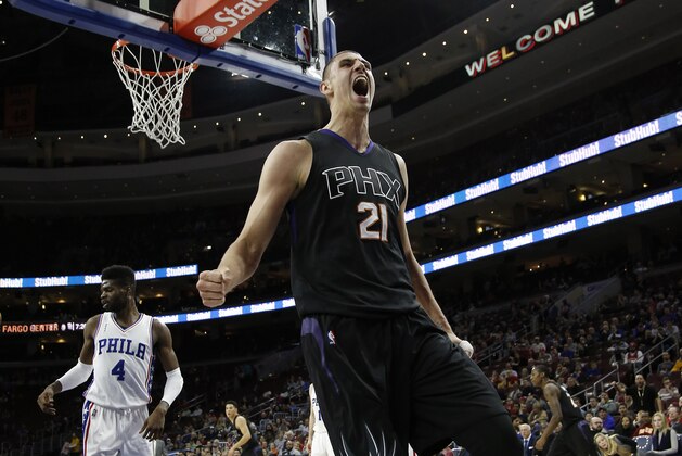 Phoenix Suns' Alex Len reacts after a dunk during the first half of an NBA basketball game against the Philadelphia 76ers, Tuesday, Jan. 26, 2016, in Philadelphia. (AP Photo/Matt Slocum)