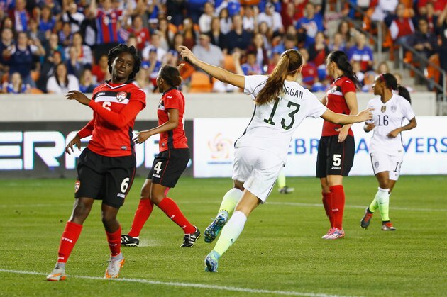 HOUSTON, TX - FEBRUARY 19:  Alex Morgan #13 of the United States (C) celebrates after she scored a goal in the second half of their game against Trinidad and Tobago during their Semifinal of the 2016 CONCACAF Women's Olympic Qualifying at BBVA Compass Stadium on February 19, 2016 in Houston, Texas.  (Photo by Scott Halleran/Getty Images)