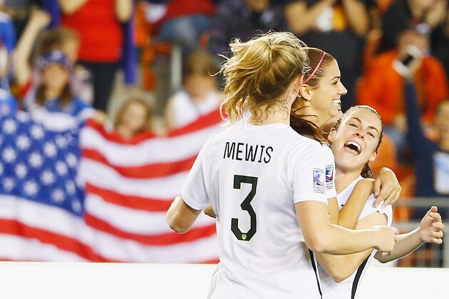 HOUSTON, TX - FEBRUARY 19:  Alex Morgan #13 of the United States (C) celebrates after she scored a goal in the second half of their game against Trinidad and Tobago during their Semifinal of the 2016 CONCACAF Women's Olympic Qualifying at BBVA Compass Stadium on February 19, 2016 in Houston, Texas.  (Photo by Scott Halleran/Getty Images)