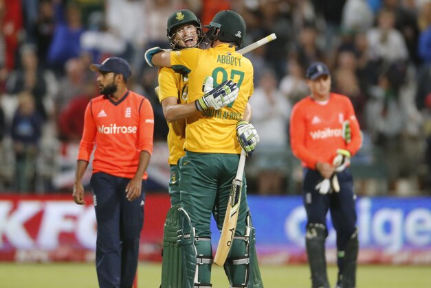 South African Kyle Abbott, front,  celebrates with South Africa’s Chris Morris as South Africa win during the T20 cricket match between South Africa and England in Cape Town, South Africa, Friday, Feb. 19, 2016. (AP Photo/Schalk van Zuydam)