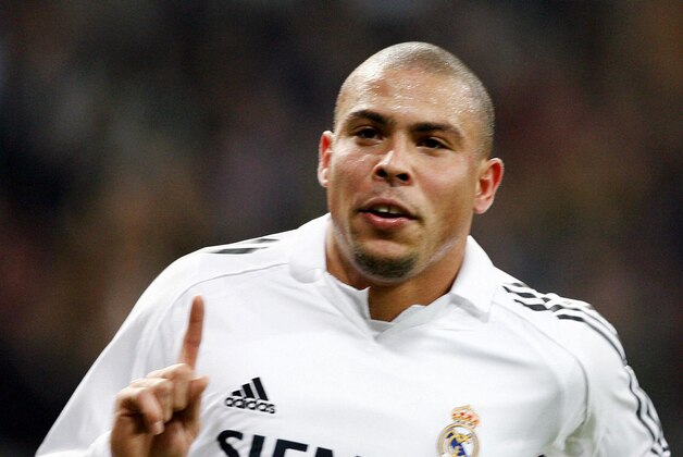 Madrid, SPAIN:  Real Madrid's Brazilian striker Ronaldo celebrate after scoring against Getafe during the Spanish League football match at the Santiago Bernabeu stadium in Madrid, 03 December 2005. AFP PHOTO/ Pedro ARMESTRE  (Photo credit should read PEDRO ARMESTRE/AFP/Getty Images)