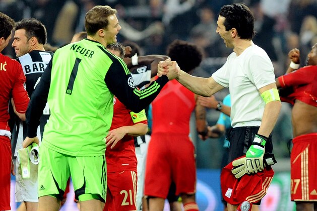 Bayern goalie Manuel Neuer, left, is congratulated by Juventus goalie Gianluigi Buffon at the end of their Champions League, quarterfinal second-leg soccer match at the Juventus stadium in Turin, Italy, Wednesday, April 10, 2013. Bayern won 2-0 and advances to the semifinals.(AP Photo/Massimo Pinca)