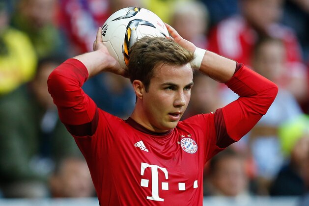 MUNICH, GERMANY - OCTOBER 04:  Mario Goetze of Bayern Muenchen takes a throw-in during the Bundesliga match between FC Bayern Muenchen and Borussia Dortmund at Allianz Arena on October 4, 2015 in Munich, Germany.  (Photo by Boris Streubel/Getty Images)