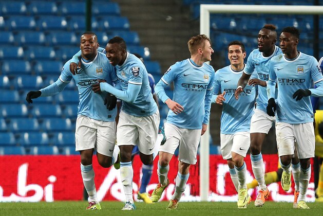 MANCHESTER, ENGLAND - MAY 01:  Oliver Ntcham of Manchester City (L) celebrates his goal with team mates during the Barclays U21 Premier League match between Manchester City U21 and Chelsea U21 at Etihad Stadium on May 1, 2014 in Manchester, England.  (Photo by Jan Kruger/Getty Images)