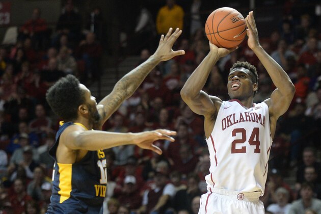 Jan 16, 2016; Norman, OK, USA; Oklahoma Sooners guard Buddy Hield (24) shoots the ball in front of West Virginia Mountaineers guard Tarik Phillip (12) during the second half at Lloyd Noble Center. Mandatory Credit: Mark D. Smith-USA TODAY Sports Jan 16, 2016; Norman, OK, USA; Oklahoma Sooners guard Buddy Hield (24) shoots the ball in front of West Virginia Mountaineers guard Tarik Phillip (12) during the second half at Lloyd Noble Center. Mandatory Credit: Mark D. Smith-USA TODAY Sports