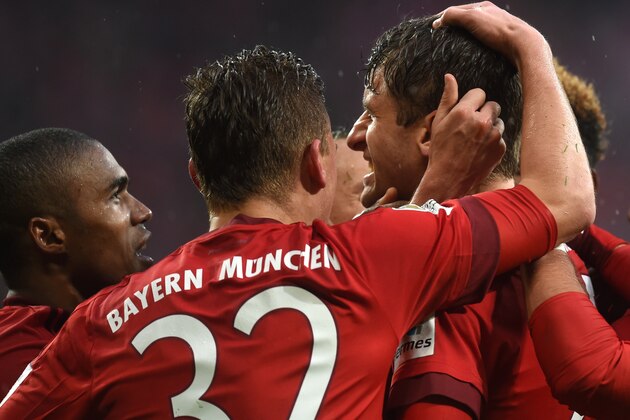 (L-R) Bayern Munich's Brazilian midfielder Douglas Costa, Bayern Munich's midfielder Joshua Kimmich and Bayern Munich's striker Thomas Mueller celebrate after the second goal during the German Bundesliga first division football match FC Bayern Munich vs SV Darmstadt 98 in Munich, southern Germany, on February 20, 2016. / AFP / CHRISTOF STACHE / RESTRICTIONS: DURING MATCH TIME: DFL RULES TO LIMIT THE ONLINE USAGE TO 15 PICTURES PER MATCH AND FORBID IMAGE SEQUENCES TO SIMULATE VIDEO. == RESTRICTED TO EDITORIAL USE == FOR FURTHER QUERIES PLEASE CONTACT DFL DIRECTLY AT + 49 69 650050
        (Photo credit should read CHRISTOF STACHE/AFP/Getty Images)