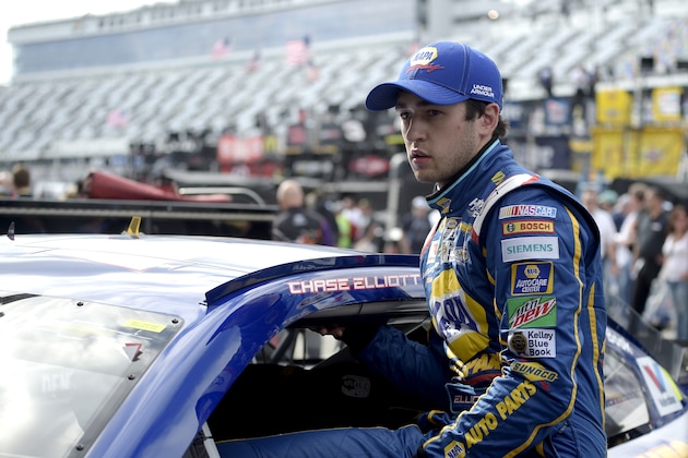 Chase Elliott climbs into his car during practice for Sunday's NASCAR Daytona 500 Sprint Cup series auto race at Daytona International Speedway in Daytona Beach, Fla., Friday, Feb. 19, 2016. (AP Photo/Phelan M. Ebenhack)
