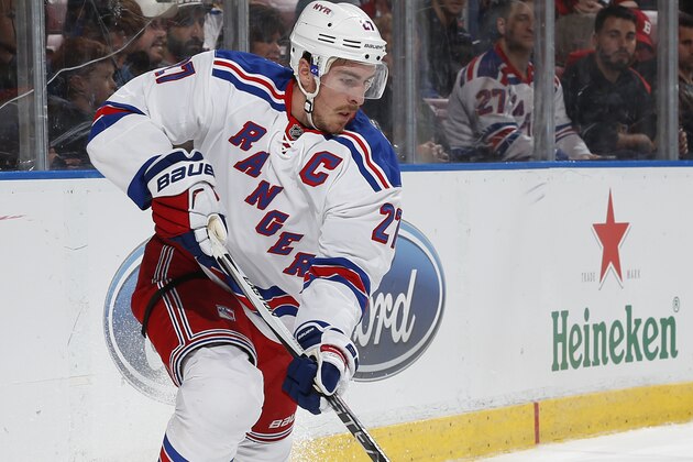 New York Rangers defenseman Ryan McDonagh (27) clears the puck from behind the net against the Florida Panthers during the first period of an NHL hockey game, Saturday, Nov. 21, 2015, in Sunrise, Fla. The Rangers defeated the Panthers 5-4 in overtime. (AP Photo/Joel Auerbach)