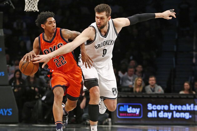 Brooklyn Nets center Andrea Bargnani (9) defends Oklahoma City Thunder guard Cameron Payne (22) as Payne drives down court in the first half of an NBA basketball game, Sunday, Jan. 24, 2016, in New York. (AP Photo/Kathy Willens)