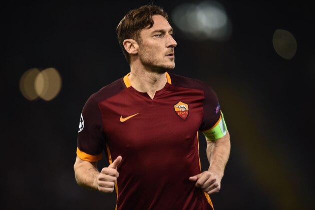 Roma's forward Francesco Totti runs during the UEFA Champions League football match AS Roma vs Real Madrid on Frebruary 17, 2016 at the Olympic stadium in Rome.    AFP PHOTO / FILIPPO MONTEFORTE / AFP / FILIPPO MONTEFORTE        (Photo credit should read FILIPPO MONTEFORTE/AFP/Getty Images)