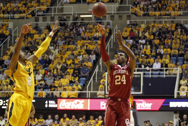 MORGANTOWN, WV - FEBRUARY 20:  Buddy Hield #24 of the Oklahoma Sooners pulls up for a shot during the game against Jevon Carter #2 of the West Virginia Mountaineers at the WVU Coliseum on February 20, 2016 in Morgantown, West Virginia.  (Photo by Justin K. Aller/Getty Images)