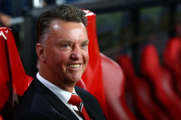 Manchester United's manager Louis van Gaal smiles prior the Champions League Group B soccer match between PSV and Manchester United at Philips stadium in Eindhoven, Netherlands, Tuesday, Sept. 15, 2015. (AP Photo/Peter Dejong)
