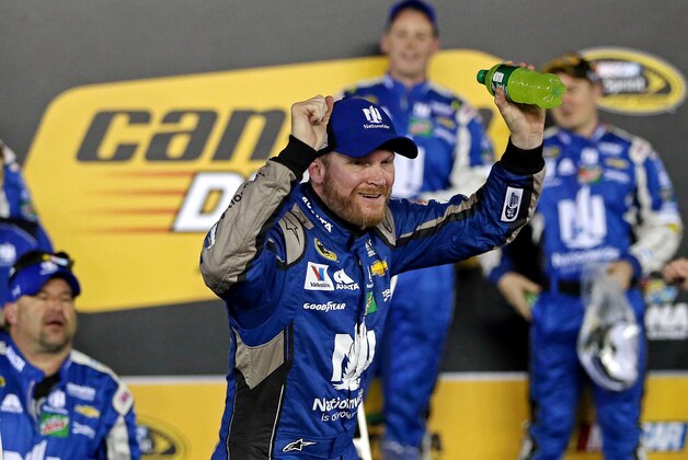 Feb 18, 2016; Daytona Beach, FL, USA; NASCAR Sprint Cup Series driver Dale Earnhardt Jr. (88) celebrates winning the Cam-Am Duels at Daytona race one at Daytona International Speedway. Mandatory Credit: Peter Casey-USA TODAY Sports