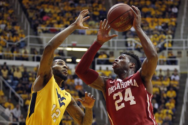 MORGANTOWN, WV - FEBRUARY 20:  Buddy Hield #24 of the Oklahoma Sooners and Tarik Phillip #12 of the West Virginia Mountaineers battle for a rebound during the game at the WVU Coliseum on February 20, 2016 in Morgantown, West Virginia.  (Photo by Justin K. Aller/Getty Images)