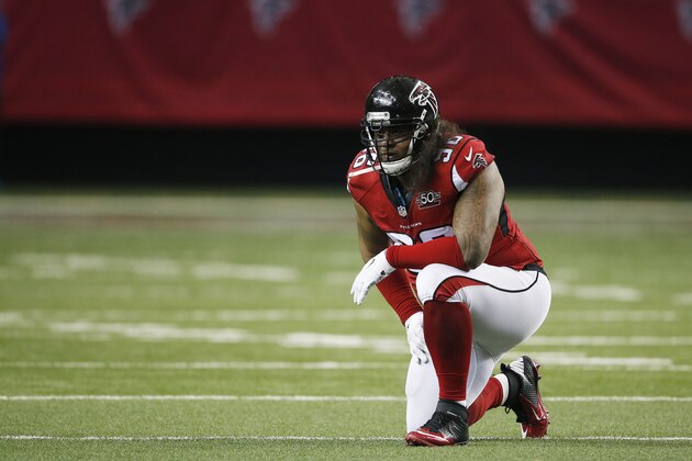 Atlanta Falcons defensive tackle Paul Soliai (96) kneels on the field due to injury against the Carolina Panthers during the first half of an NFL football game, Sunday, Dec. 27, 2015, in Atlanta. (AP Photo/John Bazemore)