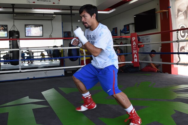This photo taken on February 15, 2016 shows Philippine boxing icon Manny Pacquiao wearing shorts and shoes with Nike logos during his training session at a gym in General Santos on the southern Philippine island of Mindanao. US sports equipment giant Nike on February 17 axed Manny Pacquiao after he described gay couples as 'worse than animals', slamming the Filipino boxer's remarks as 'abhorrent.'      AFP PHOTO / TED ALJIBE / AFP / TED ALJIBE        (Photo credit should read TED ALJIBE/AFP/Getty Images)