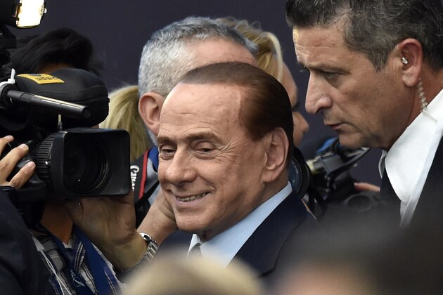 Italy's former Prime Minister Silvio Berlusconi arrives at the European People's Party Statuary Congress in Madrid on October 22, 2015. The EPP congress, which groups conservative parties from across the EU, is expected to adopt a four-page resolution tonight that calls for improvements in the reception of migrants but also demands the strengthening of the EU's external borders.   AFP PHOTO/ GERARD JULIEN        (Photo credit should read GERARD JULIEN/AFP/Getty Images)