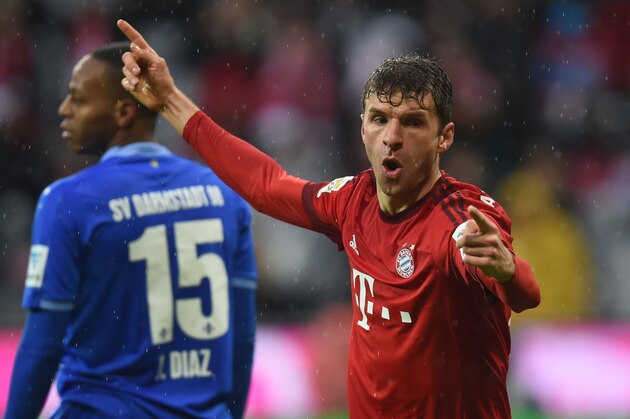 Bayern Munich's striker Thomas Mueller celebrates after the second goal during the German Bundesliga first division football match FC Bayern Munich vs SV Darmstadt 98 in Munich, southern Germany, on February 20, 2016. / AFP / CHRISTOF STACHE / RESTRICTIONS: DURING MATCH TIME: DFL RULES TO LIMIT THE ONLINE USAGE TO 15 PICTURES PER MATCH AND FORBID IMAGE SEQUENCES TO SIMULATE VIDEO. == RESTRICTED TO EDITORIAL USE == FOR FURTHER QUERIES PLEASE CONTACT DFL DIRECTLY AT + 49 69 650050
        (Photo credit should read CHRISTOF STACHE/AFP/Getty Images)