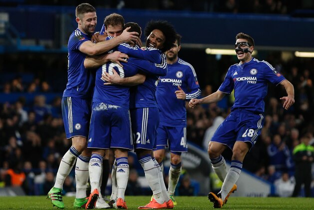 Chelsea's Belgian midfielder Eden Hazard (3rd L) celebrates with teammates after scoring their fourth goal during the English FA Cup fifth round football match between Chelsea and Manchester City at Stamford Bridge in London on February 21, 2016.  / AFP / ADRIAN DENNIS / RESTRICTED TO EDITORIAL USE. No use with unauthorized audio, video, data, fixture lists, club/league logos or 'live' services. Online in-match use limited to 75 images, no video emulation. No use in betting, games or single club/league/player publications.  /         (Photo credit should read ADRIAN DENNIS/AFP/Getty Images)