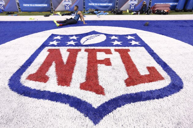 INDIANAPOLIS, IN - FEBRUARY 24: General view of the NFL shield logo in the end zone as a player rests during the 2013 NFL Combine at Lucas Oil Stadium on February 24, 2013 in Indianapolis, Indiana. (Photo by Joe Robbins/Getty Images)