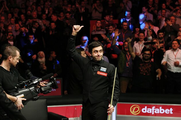 England's Ronnie O'Sullivan reacts after winning the frame to win the match and defeat England's Barry Hawkins (not pictured) in the Masters Snooker final at Alexandra Palace in north London on January 17, 2016. O'Sullivan overwhelmed Barry Hawkins 10-1 to win the final of the Masters snooker tournament at London's Alexandra Palace on Sunday.  AFP PHOTO / ADRIAN DENNIS / AFP / ADRIAN DENNIS        (Photo credit should read ADRIAN DENNIS/AFP/Getty Images)