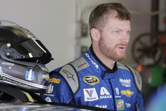 Dale Earnhardt Jr looks from the garage during practice for Sunday's NASCAR Daytona 500 Sprint Cup series auto race at Daytona International Speedway in Daytona Beach, Fla., Friday, Feb. 19, 2016. (AP Photo/Terry Renna)