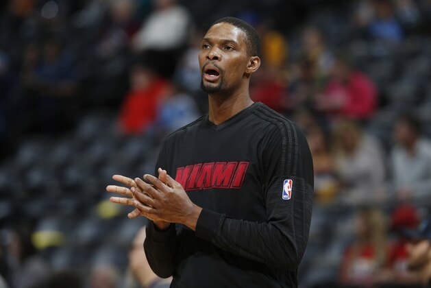 Miami Heat forward Chris Bosh (1) during the first half of an NBA basketball game Friday, Jan. 15, 2016, in Denver. (AP Photo/David Zalubowski)