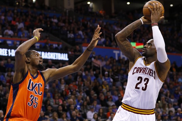 Oklahoma City Thunder forward Kevin Durant (35) defends as Cleveland Cavaliers forward LeBron James (23) shoots during the first quarter of an NBA basketball game in Oklahoma City, Sunday, Feb. 21, 2016. (AP Photo/Alonzo Adams)