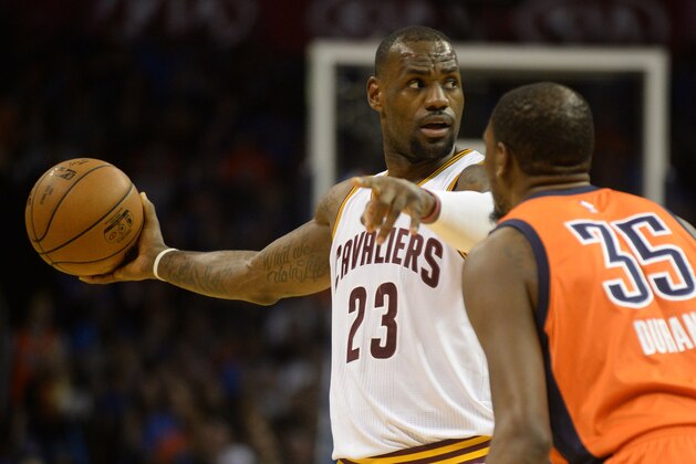 Feb 21, 2016; Oklahoma City, OK, USA; Cleveland Cavaliers forward LeBron James (23) controls the ball as Oklahoma City Thunder forward Kevin Durant (35) defends during the first quarter at Chesapeake Energy Arena. Mandatory Credit: Mark D. Smith-USA TODAY Sports