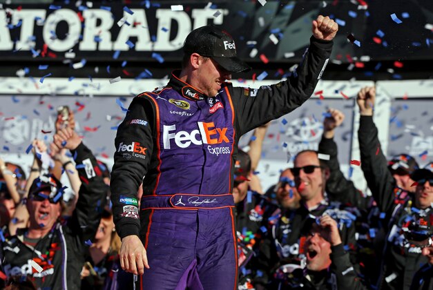 Feb 21, 2016; Daytona Beach, FL, USA; NASCAR Sprint Cup Series driver Denny Hamlin (11) celebrates winning the Daytona 500 at Daytona International Speedway. Mandatory Credit: Peter Casey-USA TODAY Sports