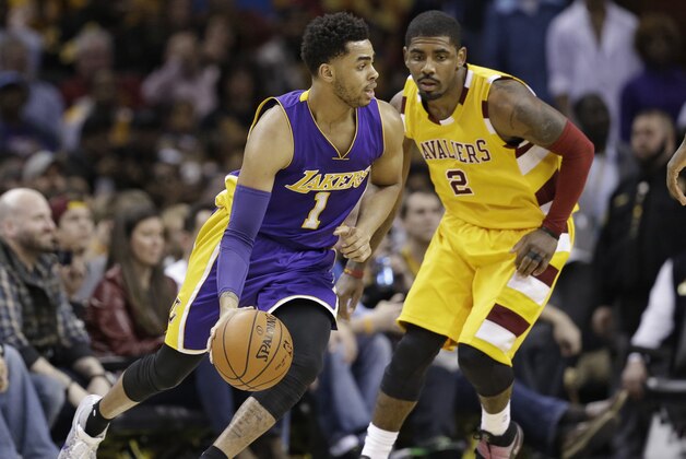 Los Angeles Lakers' D'Angelo Russell (1) drives against Cleveland Cavaliers' Kyrie Irving (2) in the second half of an NBA basketball game Wednesday, Feb. 10, 2016, in Cleveland. (AP Photo/Tony Dejak)