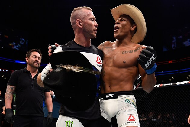 PITTSBURGH, PA - FEBRUARY 21:  (L-R) Donald Cerrone and Alex Oliveira hug after their welterweight bout during the UFC Fight Night event at Consol Energy Center on February 21, 2016 in Pittsburgh, Pennsylvania. (Photo by Jeff Bottari/Zuffa LLC/Zuffa LLC via Getty Images)