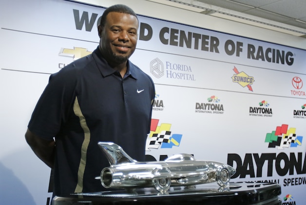 Baseball Hall of Fame centerfielder Ken Griffey Jr poses with the Daytona 500 winner's trophy during a news conference before the NASCAR Daytona 500 Sprint Cup Series auto race at Daytona International Speedway in Daytona Beach, Fla., Sunday, Feb. 21, 2016. Griffey is the honorary starter of the race. (AP Photo/Terry Renna)