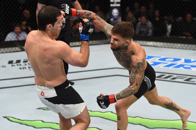 PITTSBURGH, PA - FEBRUARY 21:  (R-L) Cody Garbrandt punches Augusto Mendes in their bantamweight bout during the UFC Fight Night event at Consol Energy Center on February 21, 2016 in Pittsburgh, Pennsylvania. (Photo by Jeff Bottari/Zuffa LLC/Zuffa LLC via Getty Images)