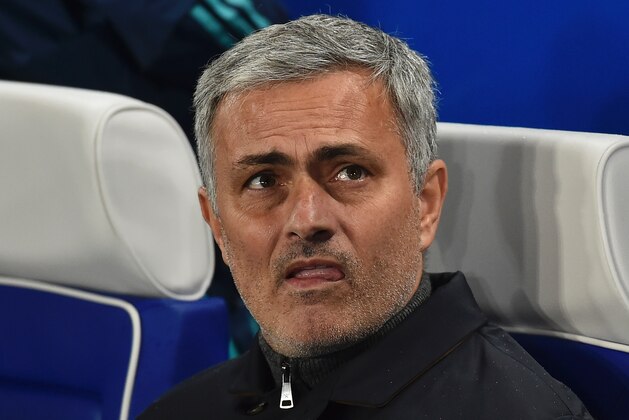 Chelsea's Portuguese manager Jose Mourinho takes his seat for the UEFA Champions League Group G football match between Chelsea and Porto at Stamford Bridge in London on December 9, 2015.  AFP PHOTO / BEN STANSALL / AFP / BEN STANSALL        (Photo credit should read BEN STANSALL/AFP/Getty Images)