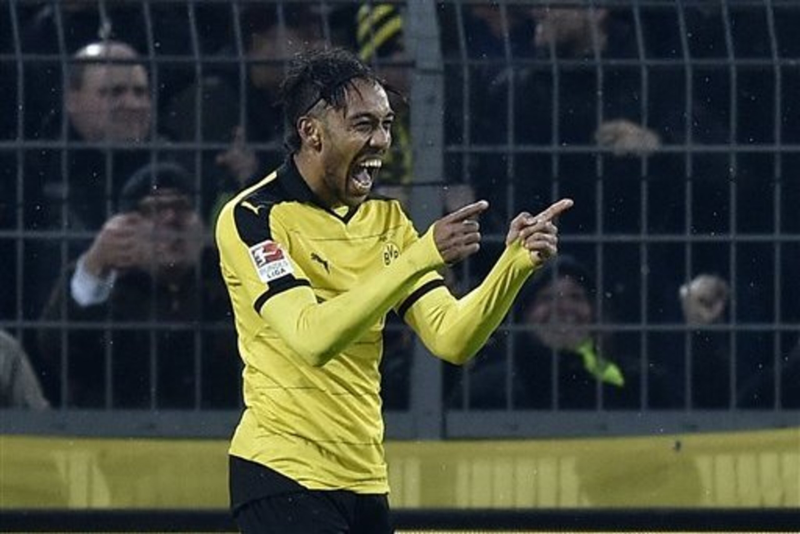 Dortmund's Pierre-Emerick Aubameyang celebrates after scoring his second goal during the German Bundesliga soccer match between Borussia Dortmund and FC Ingolstadt in Dortmund, Germany, Saturday, Jan. 30, 2016. (AP Photo/Martin Meissner)