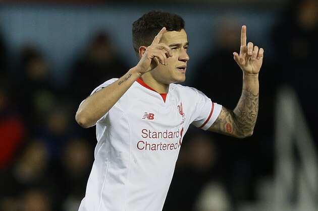 Liverpool's Philippe Coutinho celebrates scoring a goal during the English FA Cup fourth round replay soccer match between West Ham United and Liverpool at the Boleyn Ground stadium in London, Tuesday, Feb. 9, 2016. (AP Photo/Kirsty Wigglesworth)