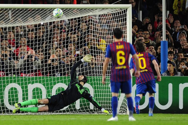 Barcelona's Argentinian forward Lionel Messi (R) misses a penalty shot against Chelsea's Czech goalkeeper Petr Cech (L) during the UEFA Champions League second leg semi-final football match Barcelona against Chelsea at the Cam Nou stadium in Barcelona on April 24, 2012.  AFP PHOTO / JAVIER SORIANO (Photo credit should read JAVIER SORIANO/AFP/Getty Images)