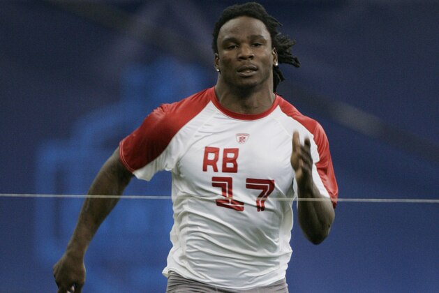 Running back Chris Johnson, of East Carolina, runs the 40-yard dash at the NFL Combine in Indianapolis, Sunday, Feb. 24, 2008.  (AP Photo/Michael Conroy)