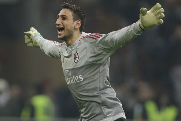AC Milan goalkeeper Gianluigi Donnarumma celebrates at the end of a  Serie A soccer match between AC Milan and Inter Milan, at the San Siro stadium in Milan, Italy, Sunday, Jan. 31, 2016.  Milan won 3-0. (AP Photo/Luca Bruno)