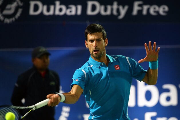 Serbian Novak Djokovic returns the ball to Spanish Tommy Robredo during their ATP tennis match on the first round of the Dubai Duty Free Tennis Championships on February 22, 2016.  / AFP / MARWAN NAAMANI        (Photo credit should read MARWAN NAAMANI/AFP/Getty Images)